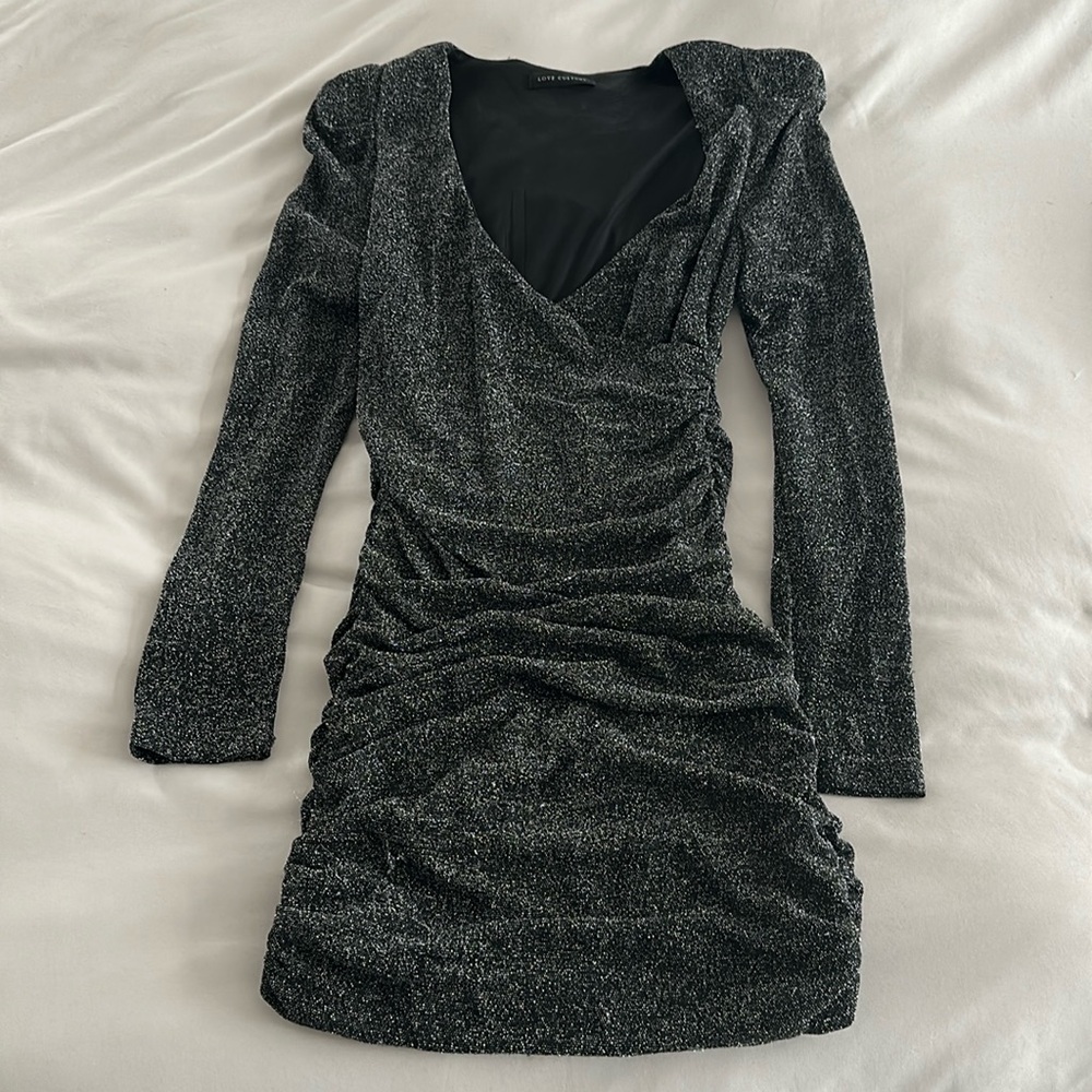 Sparkly black long sleeve ruched slightly padded shoulder mini dress